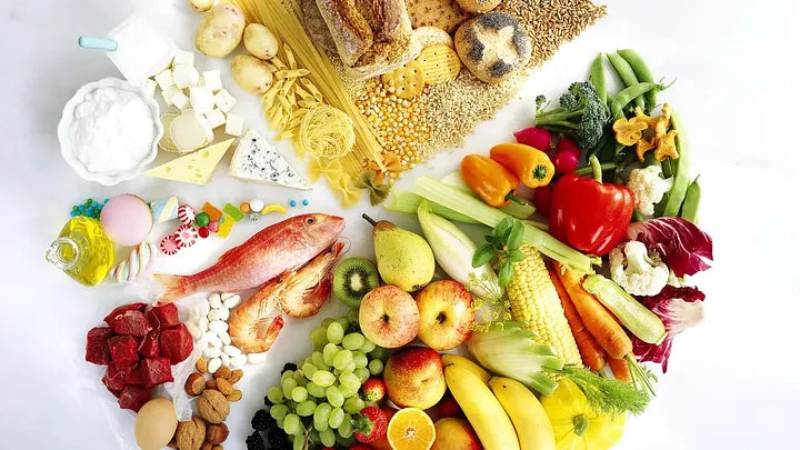 Smiling person preparing a colorful, balanced meal while tracking macros on a smartphone—symbolizing flexible dieting and sustainable health.
