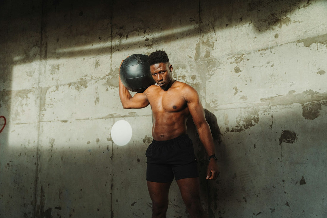 Bodybuilder demonstrating proper lifting technique in gym, emphasizing form, weight, and muscle growth.