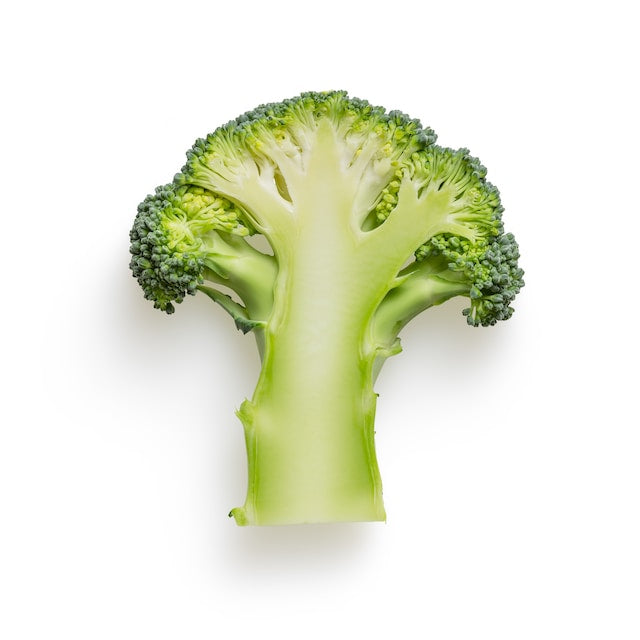 Fresh assortment of leafy greens, broccoli, and sweet potatoes on a wooden table, highlighting top super vegetables for better health.